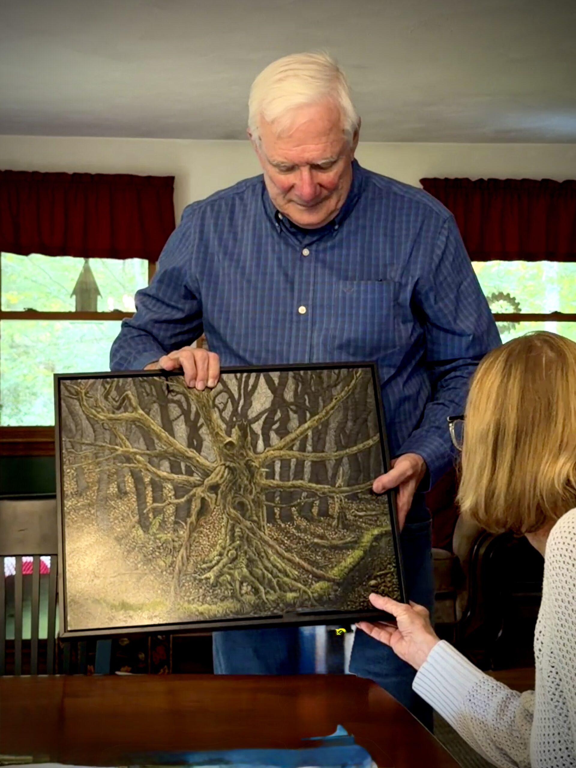Joe with Tree painting looking down